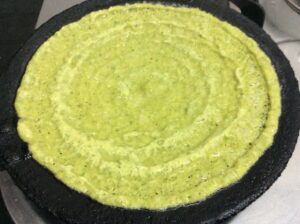 Green batter on a hot griddle